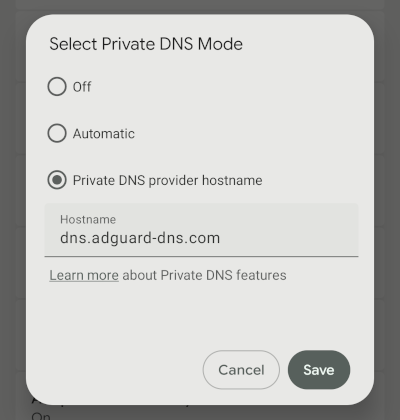 Private DNS provider hostname selected with dns.adguard-dns.com entered on Android